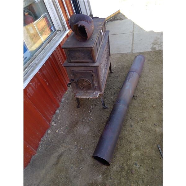 Vintage wood stove with fluted chimney section and elbow section