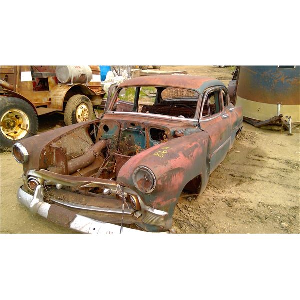 Car shell with vintage 1960 front plate u/k year make model