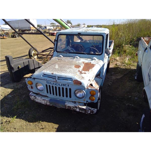 Suzuki Truck  has key U/K year model and VIN quarter sized hole in floors boards extra parts in cab 