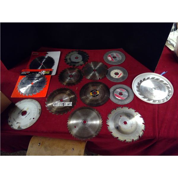3 grinding disks and 9 used saw blades, 2 new saw blades