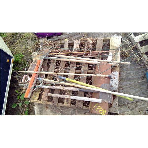 Sholvels, brooms, scrapers, post maul, and rebar on pallet