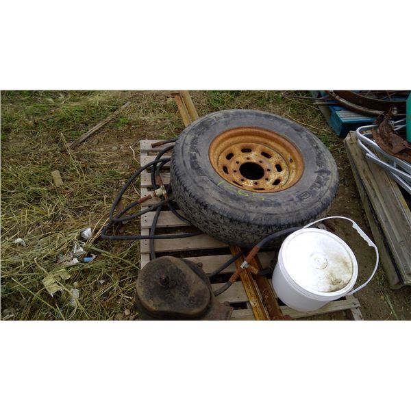 LT235/85 R16 Tire/rim and misc on pallet