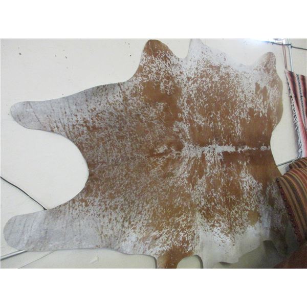 Large Tanned Cowhide With Brand- SB Slash- New Condition- Approximately 80" X 70"