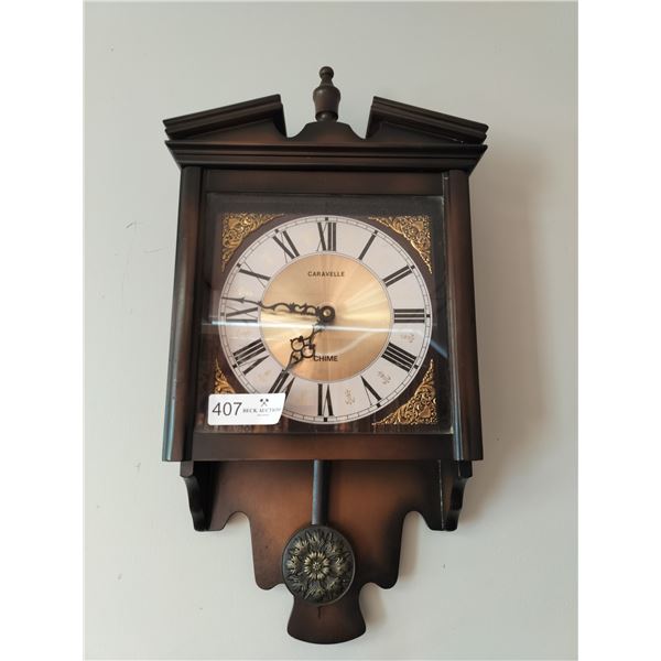 Caravelle Wall Mounted Pendulum Wall Clock 22 High x 12 Wide x 5 Deep