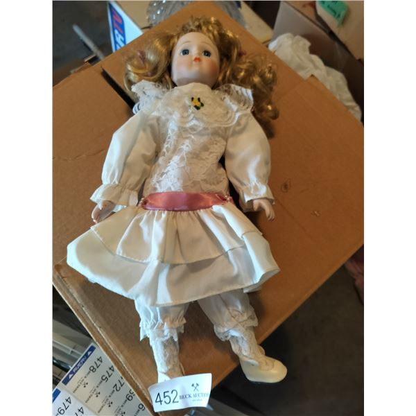 Porcelain Doll in a White Dress