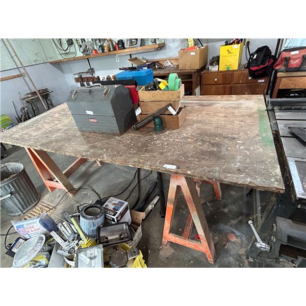 2 Sawhorses With A Sheet Of Wood. 96 Long 48 Wide 35 High Table.
