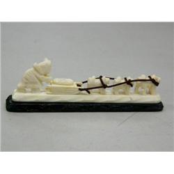 Ivory Man with a Dog Team