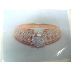 14 K yellow gold lady's ring, one round brilliand cut diamond approx. .70 cts accented with .26 cts 