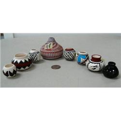 Wonderful collection of 8 little pots from 1"- 2 1/4" signed by Atnt & Jones