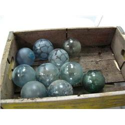 CHOICE on 3 crates of Glass Balls, laid on beach and have been sand blasted