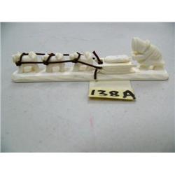 CHOICE on 2 Ivory Dogsled Figurines