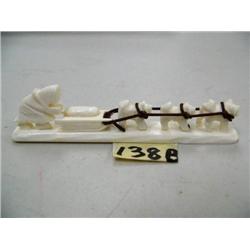 CHOICE on 2 Ivory Dogsled Figurines