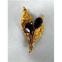 Gold Nuggeted Leaf Pin Set with a Garnet