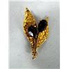 Image 1 : Gold Nuggeted Leaf Pin Set with a Garnet