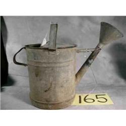 Old galvanized watering can