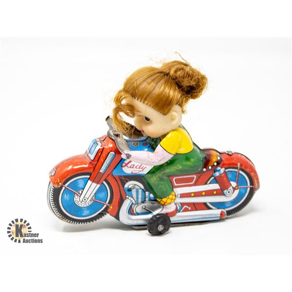 1950S HAJI JAPAN TIN MOTORCYCLE WITH GIRL RIDER