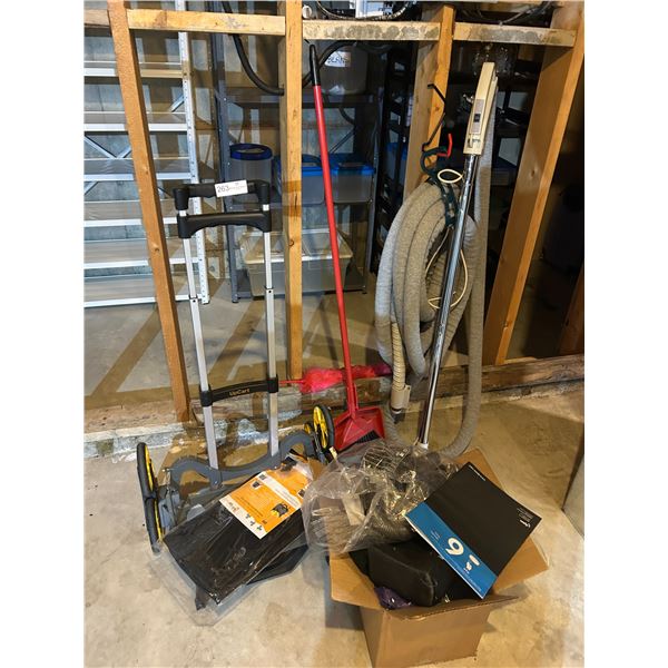 Hand Truck With Wheels And A Broom And A Vintage Vacuum