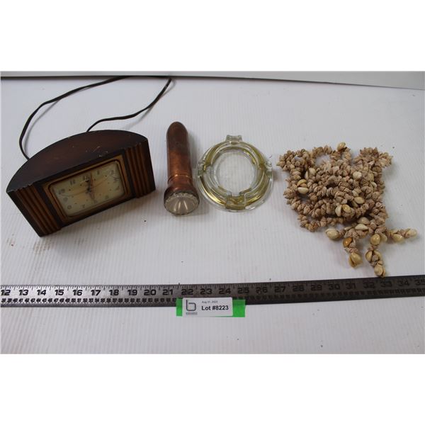 Flashlight, Shell Necklace, Clock and Tray