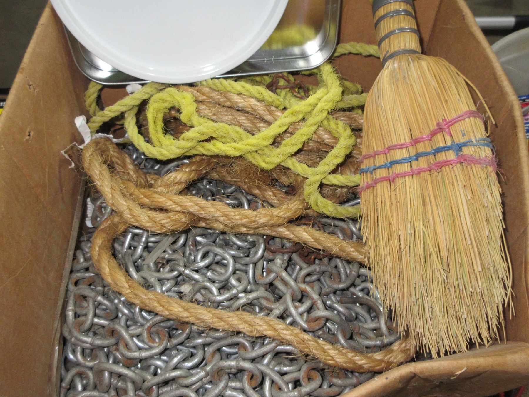 ESTATE: BOX C/W CORN BROOM, ROPE, CHAINS, ETC