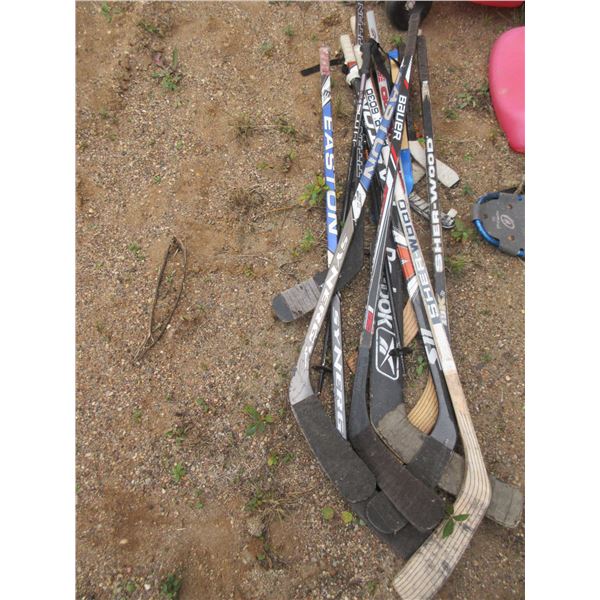PILE OF ASSORTED HOCKEY STICKS