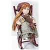 Image 1 : PORCELAIN DOLL ON A ROCKING CHAIR