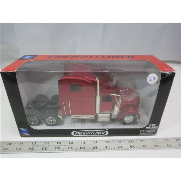 New Ray 1:32 Freightliner semi-truck diecast model in box