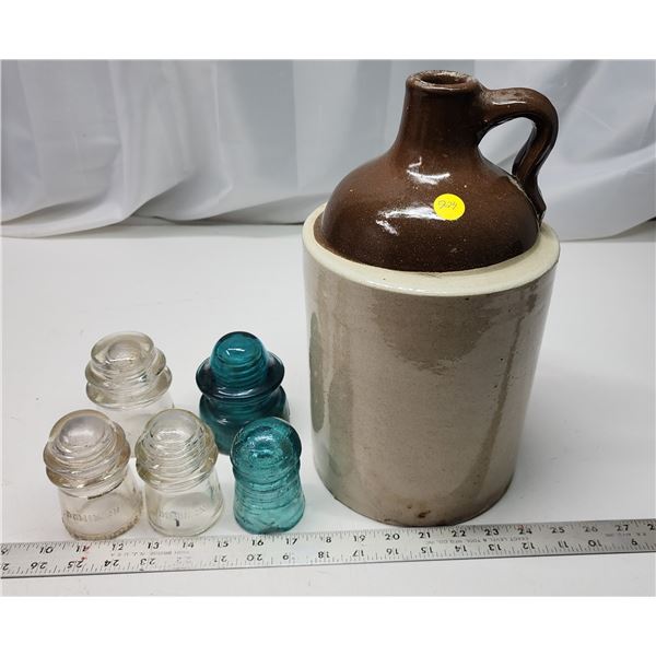 Whiskey jug and 5 assorted glass insulators