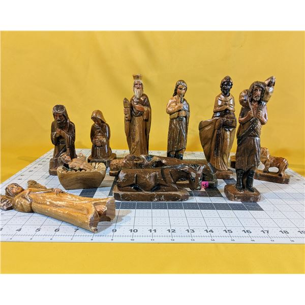 Old, hand-crafted and hand-painted, 14-piece nativity scene wood figurines.