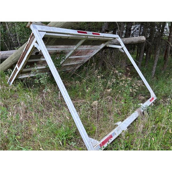 SELLING OFF SITE: White over-cab protection mesh frame, For more info PH Mel (780) 446-8197. Address