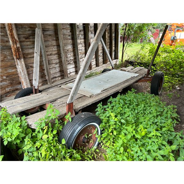SELLING OFF SITE: 4 Wheel wagon c/w wooden deck, For more info PH Mel (780) 446-8197. Address: 60110