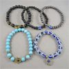 Image 1 : Set of 5 Protection Bracelets - Greek Evil Eye, Hamsa Hand, Black Onyx