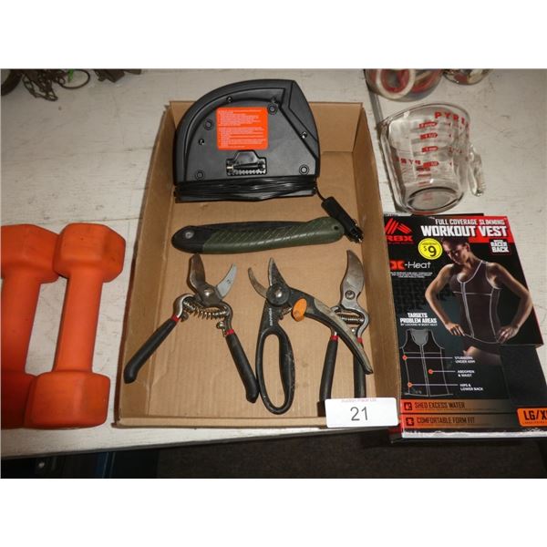 snips, measuring cup, dumbbells, workout vest