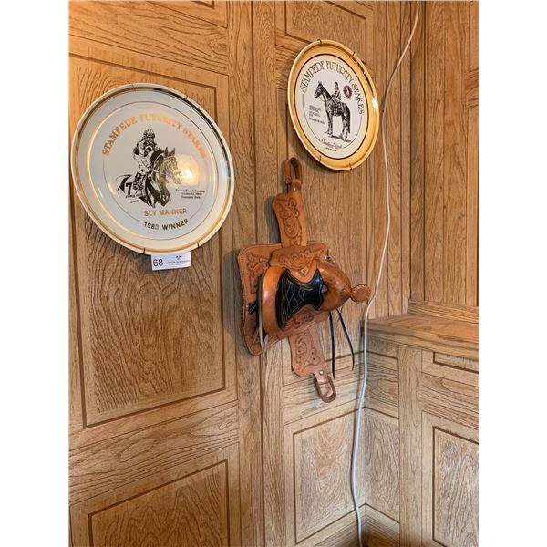 Lot of Stampede Collectible Plates and Decorative Saddle