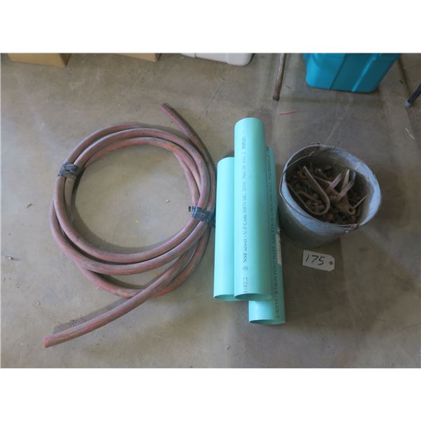 Lot of hose, sewer piping, & bucket of assorted metal parts, bolts, etc.
