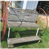 Image 1 : 58.5” x 55” Lawn bench with 2 Antique metal tires (54” diameter)