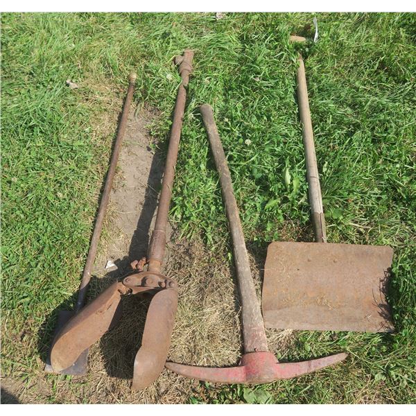 Lot of yard tools: Shovel, Pick Axe, Post Auger