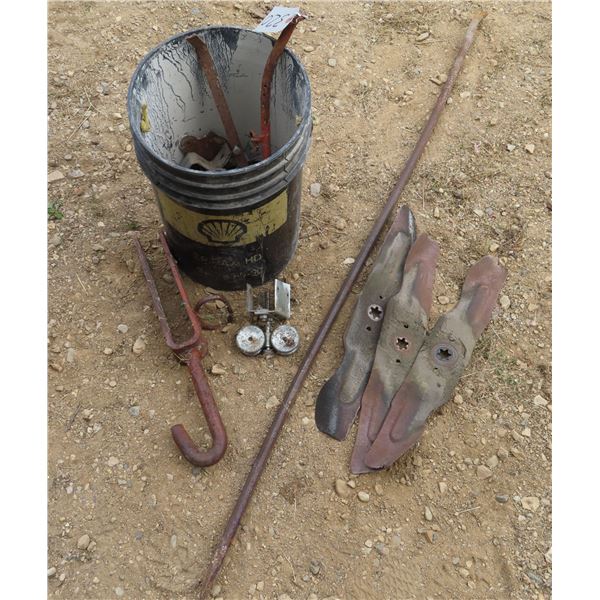 Bucket of assorted metal tools and parts.