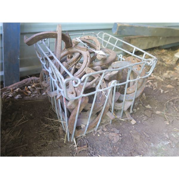 Metal crate of horse shoes
