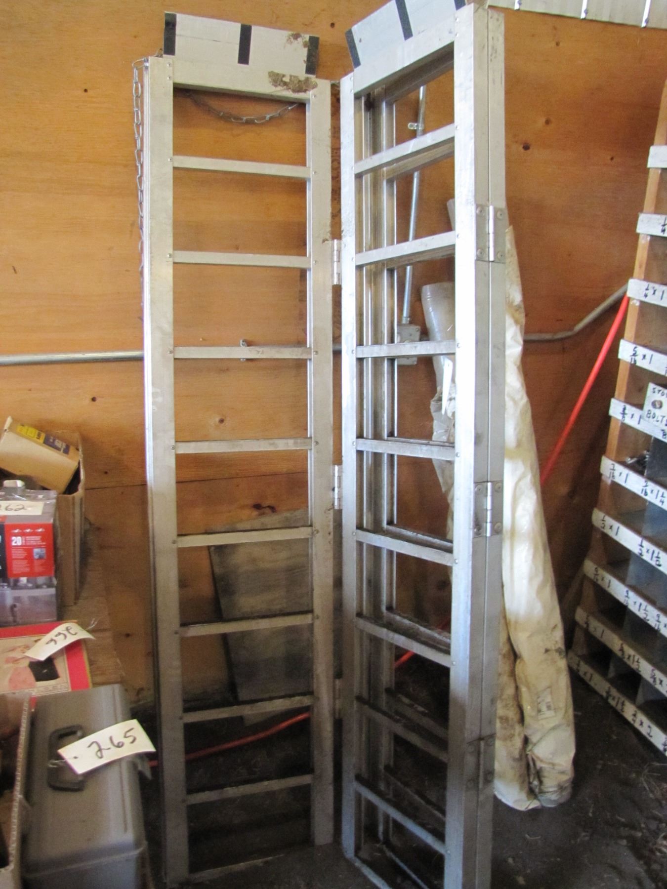 Set up folding quad ramps for loading onto vehicle etc