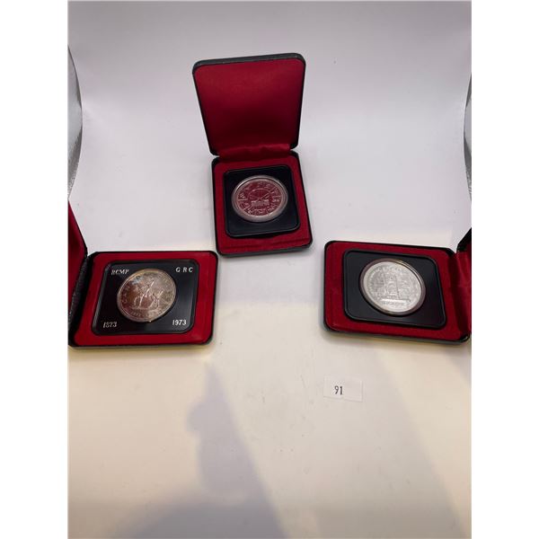 1977 Canada 25th Anni. Silver Dollar/1976 Commonwealth Game token/1973 RCMP Dollar