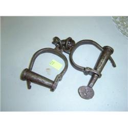 PAIR OF OLD HAND CUFFS WITH KEY; STAMPED #41