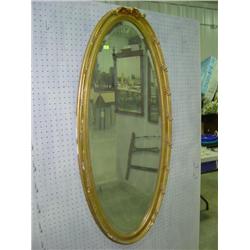 LARGE OVAL GUILTED FRAMED MIRROR; BEVELED GLASS; DAMAGE ON PARTS OF FRAME; 24 1/2 X 52 1/2