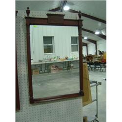 MAHOGANY MIRROR WITH CARVED COLUMNS AND FINIALS; SHOWS WEAR IN FINISH