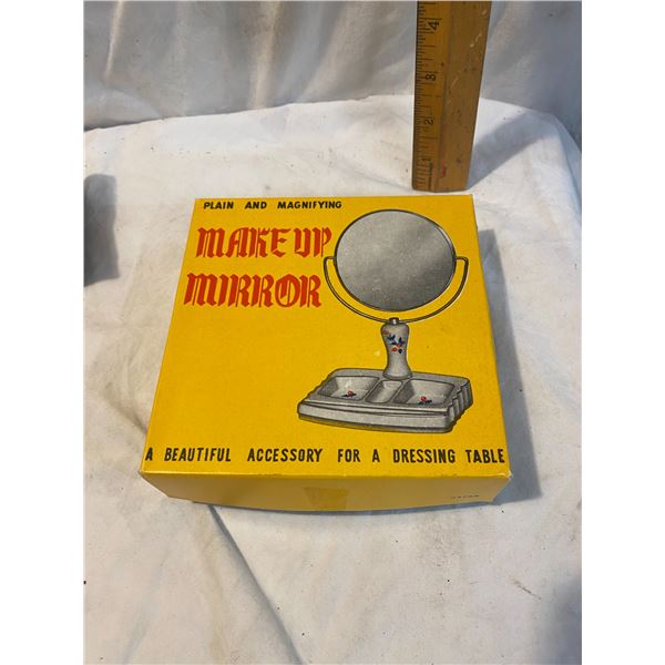 Plain and magnifying make up mirror