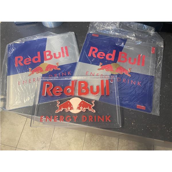 2 red bull tin signs and other red bull sign