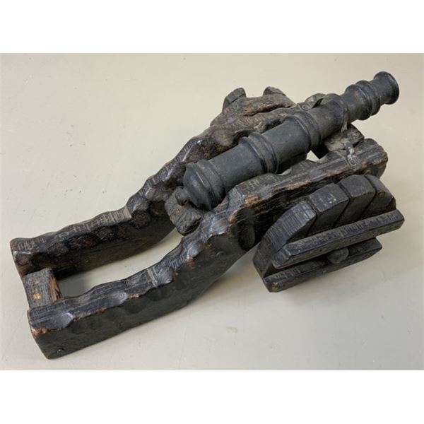 ANTIQUE MODEL OF A METAL CANNON WITH WOODEN MOUNT