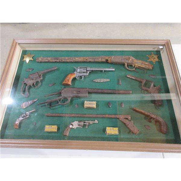 Display of Antique Deactivated Dug Up Guns, Arrowheads