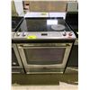 Image 1 : MAYTAG STAINLESS STEEL 4 BURNER 1 WARMER ELECTRIC STOVE WITH CONVECTION OVEN