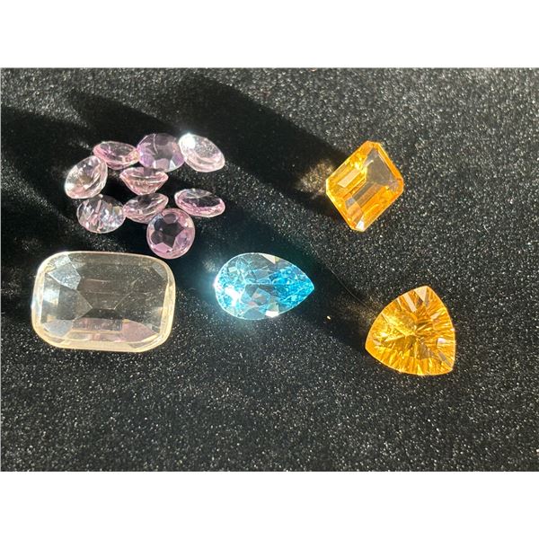 ASSORTED GEMS INCLUDING, 9 AMETHYSTS, 1 TOPAZ, 2 CITRINE, 1 SMOKEY QUARTZ. VARIOUS SIZES