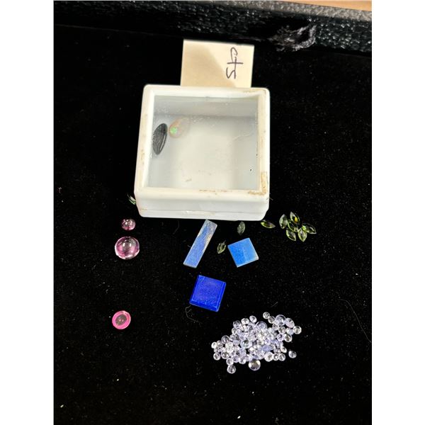 ASSORTED GEMS INCLUDING; 2 OPALS, 3 LAPIS LAZULI, MIXED TANZANITE, 10 TOURMALINES, & 3 GARNETS.
